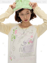 BETWEENAND ミュージックノート ローズプリント ロングスリーブTシャツ