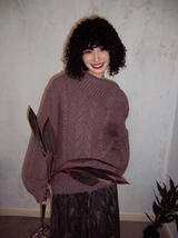 Relaxed and retro collarless sweater with a laid-back vibe