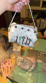 floral-embroidered pouch