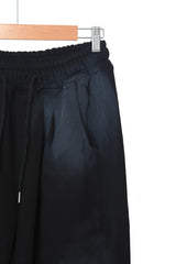 spray-washed string pants