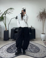 Pale studded strap pants