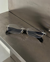 chrome cross-rimmed glasses