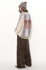 Loose lapel, raglan sleeve, color-blocked striped, cut-out printed sweater