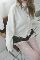 Rough damaged cardigan