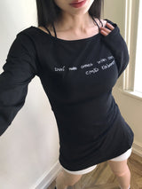 クメンレタリングリップネックスリムロングスリーブTシャツ