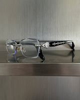 chrome cross-rimmed glasses
