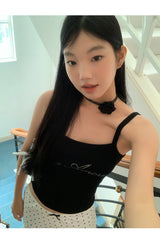 Marshmallow beaded black sleeveless top
