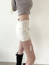 1438. Cross strap ribbon mini sk (2color)