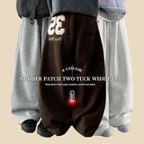 Kello 35 patch embroidered pin tuck wide pants