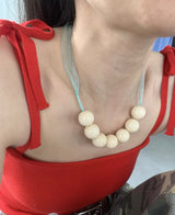 Yellow ball@mint tie necklace