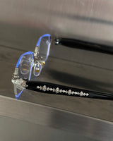 chrome cross-rimmed glasses
