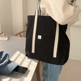 White on black tote bag
