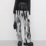 yellow-colored patterned pants