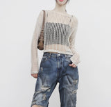 a see-through cropped knitwear