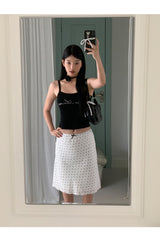 Marshmallow beaded black sleeveless top