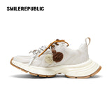 Off-White Burnished Leather Low Top Chunky Sneakers with Tassel Charms, Unisex