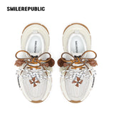 Off-White Burnished Leather Low Top Chunky Sneakers with Tassel Charms, Unisex