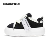 Black Canvas Interchangeable Smile Toe Chunky Platform Sneakers with Airplane Ticket Tag