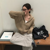 [BELLIDE MADE] ペンダント付きケーブルニットジップアップ