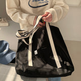 White on black tote bag