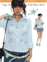 BETWEENAND summer shirt with mint blue stripes, diamond-encrusted waistline, and short sleeves