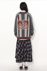Loose lapel, raglan sleeve, color-blocked striped, cut-out printed sweater
