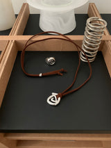 Spiral symbol suede necklace