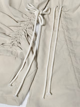  CUT OUT STRING CAGO PANTS . DRITY BEIGE