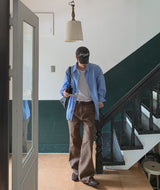 Curden Diagonal Cut Curved Bootcut Pants