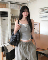 [U-BASIC] Rollin Button Round Sleeveless Top