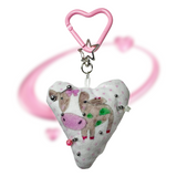 Pierced pinky cow keychain