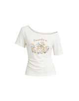 ダイアサマーヴィンテージグラフィックシャーリングワンショルダーTシャツ アイボリー