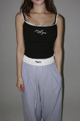 Lace lettering padded sleeveless shirt with a built-in cap