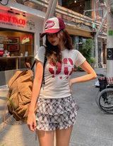 90 プリント半袖スリムTシャツ