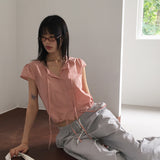 Cuyan dot button strap short-sleeve blouse