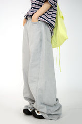over wide gray pants