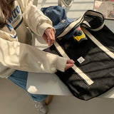 White on black tote bag
