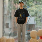 DAKYAM 2025S/S スターリースカイギディングライトプリンティングTシャツ
