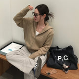 [BELLIDE MADE] ペンダント付きケーブルニットジップアップ