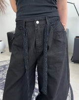 Pale studded strap pants