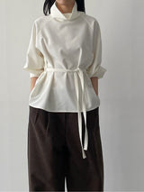 High-neck belted balloon-fit blouse
