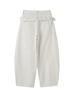 Pale studded strap pants