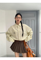 a forsythia striped loose-fit shirt