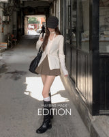 MADE. Rua pleated mini skirt with built-in shorts