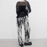 yellow-colored patterned pants