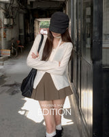 MADE. Rua pleated mini skirt with built-in shorts