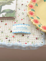 Floral table mat light blue accents