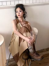 A long, loose and slimming knitted dress for a niche market.