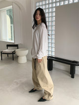 CURVED TUCK COTTON TROUSER