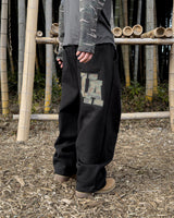 UA カモパッチワイドスウェットパンツ